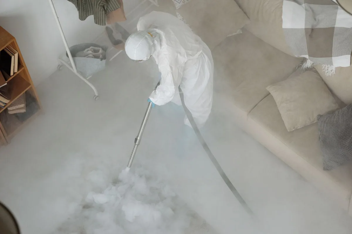 Biohazard cleanup technician in protective equipment, Lebanon, VA